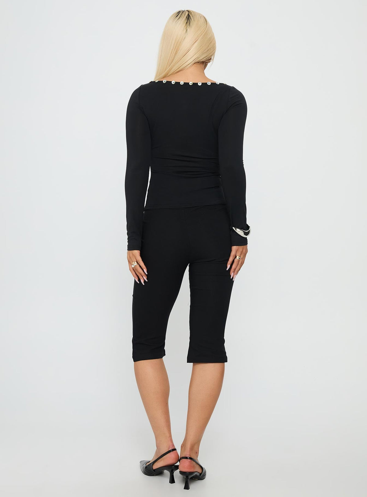 back view of model wearing Princess Polly Samaira Capri Pant Black Mid Rise Pants 