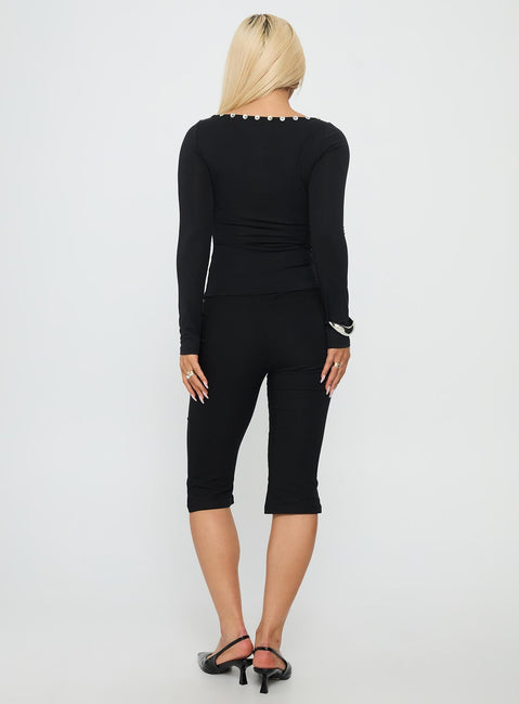 back view of model wearing Princess Polly Samaira Capri Pant Black Mid Rise Pants 