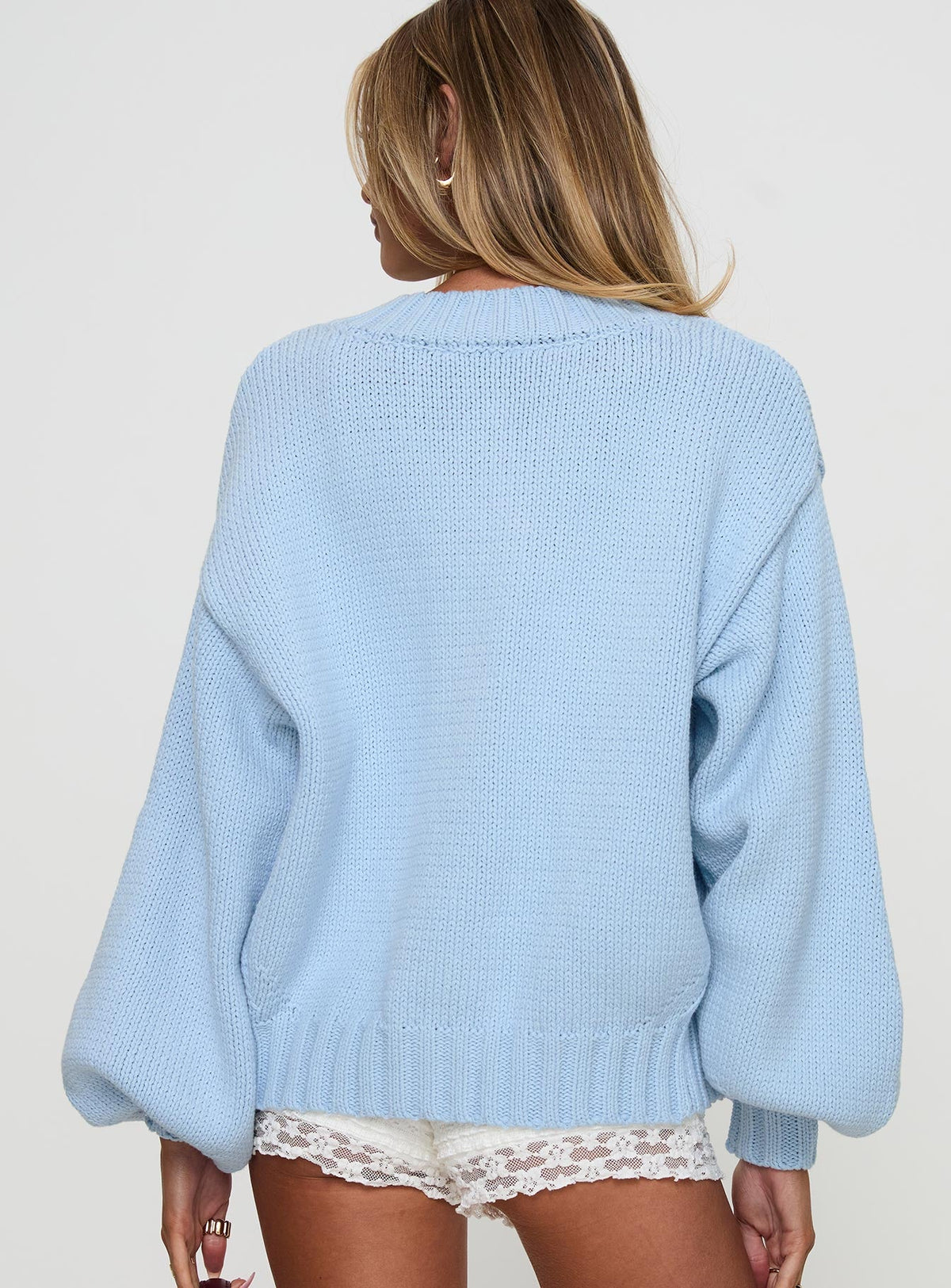 back view of model wearing Princess Polly Edern Cardigan Blue cropped 