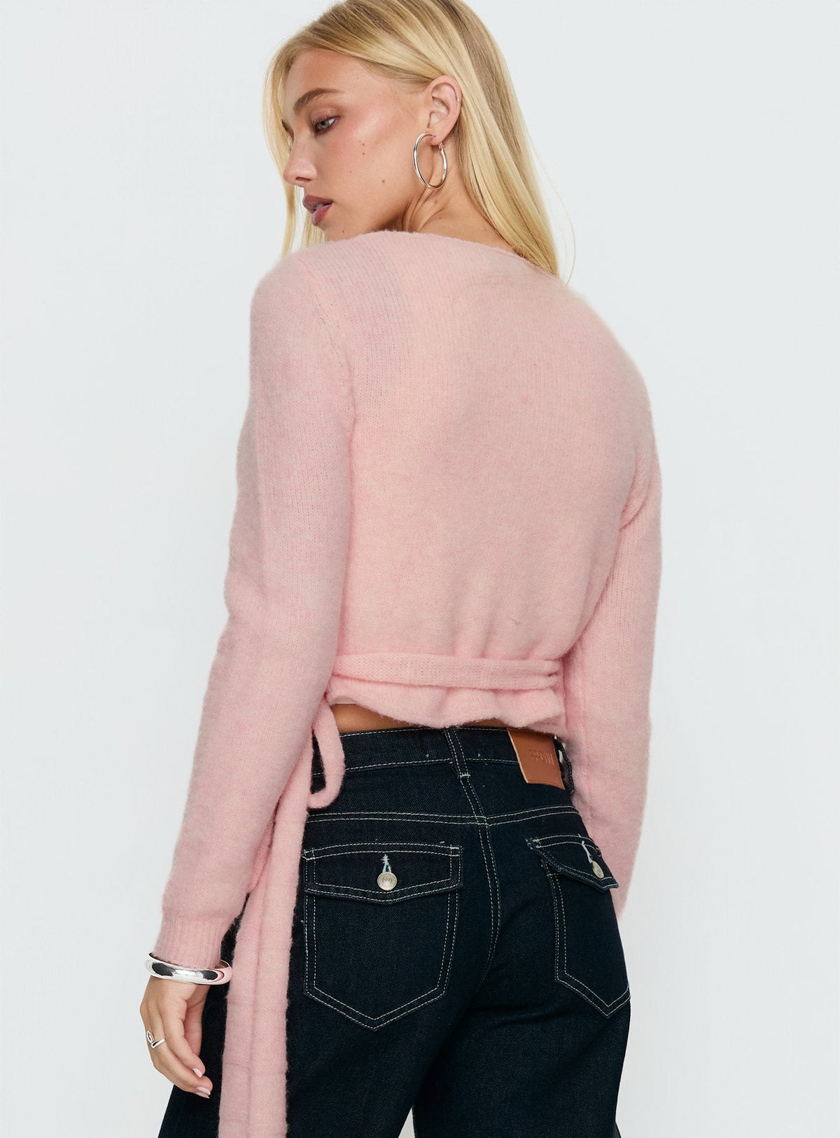 back view of model wearing Princess Polly Tonee Wrap Knit Cardigan Pink cropped Jumpers 