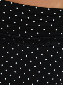 Highlighting the Amia Lace Mini Skirt Black Polka Dot womens-skirts with fitted aline shape featuring hem detail Princess Polly