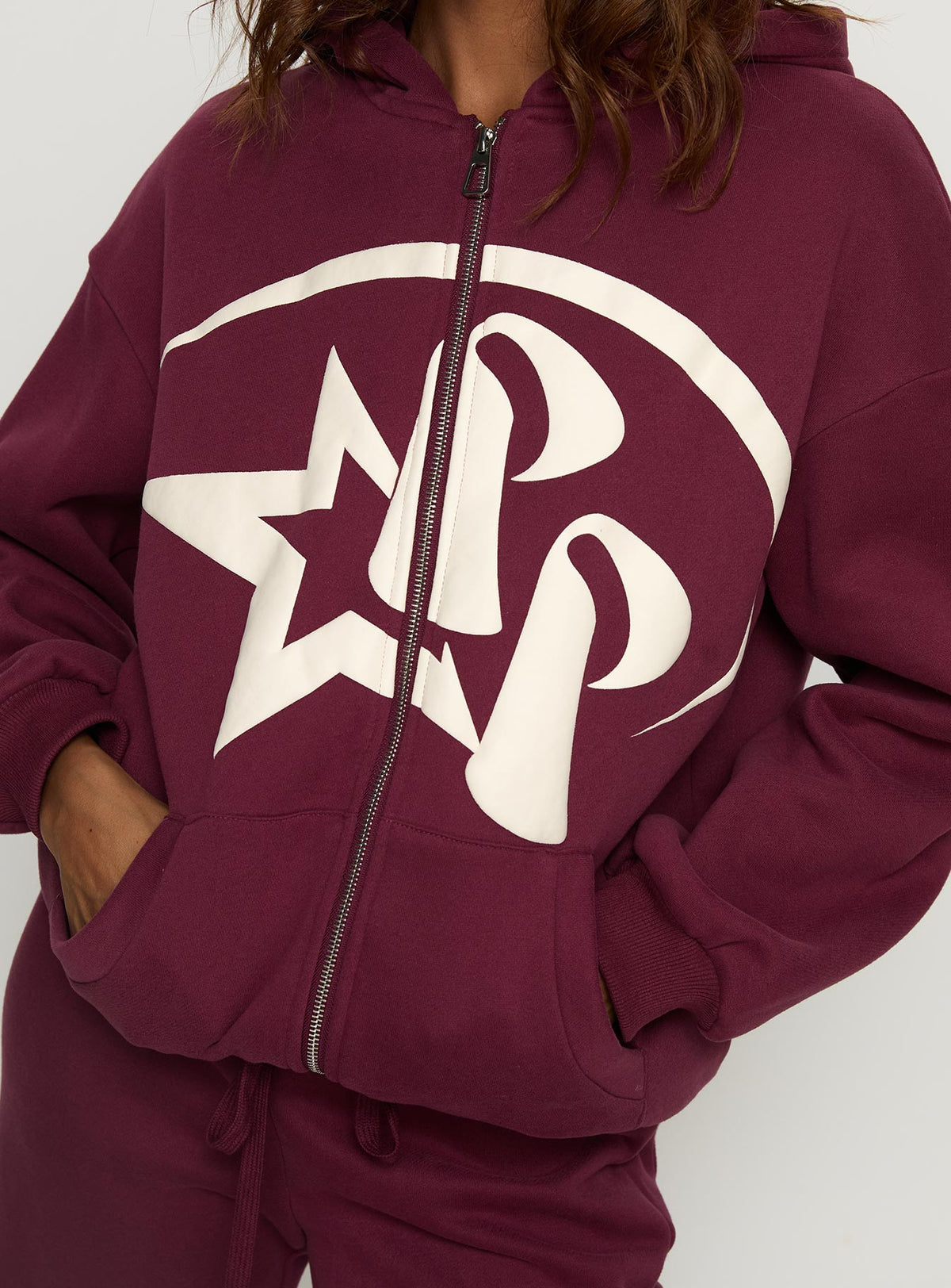 front view of model wearing Princess Polly Princess Polly Stargirl Zip Through Jumper Burgundy 