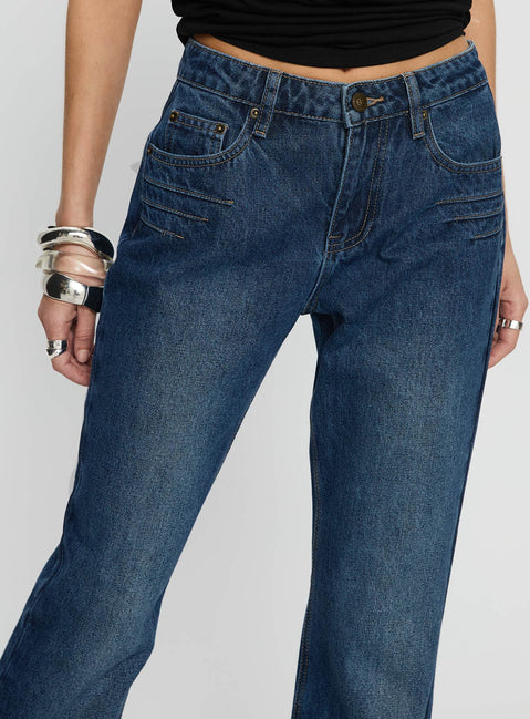 back view of model wearing Princess Polly Wide World Mid Rise Bootleg Jeans Mid Blue Mid Rise Jeans 