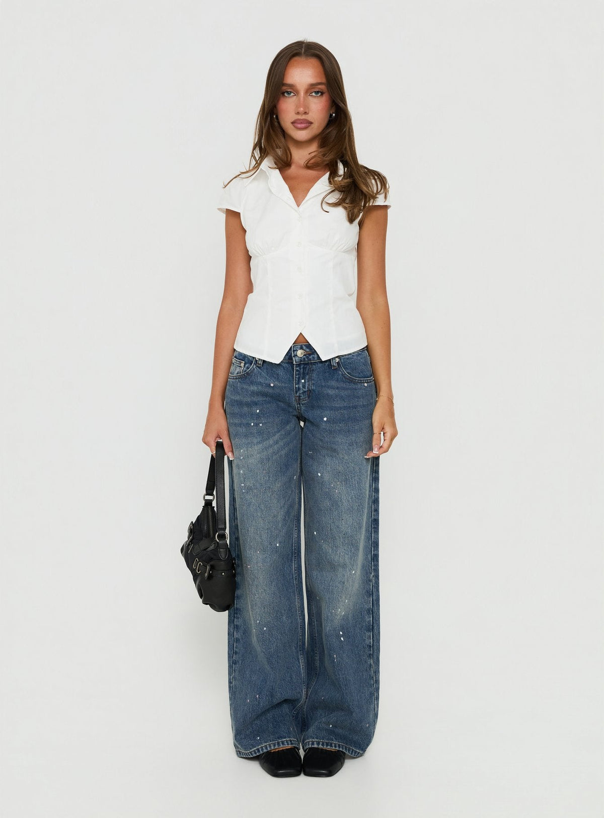 Showcasing the Ellanor Low Rise Paint Straight Leg Jean Vintage Mid Blue in womens-jeans featuring low-rise waist front view of model wearing Princess Polly