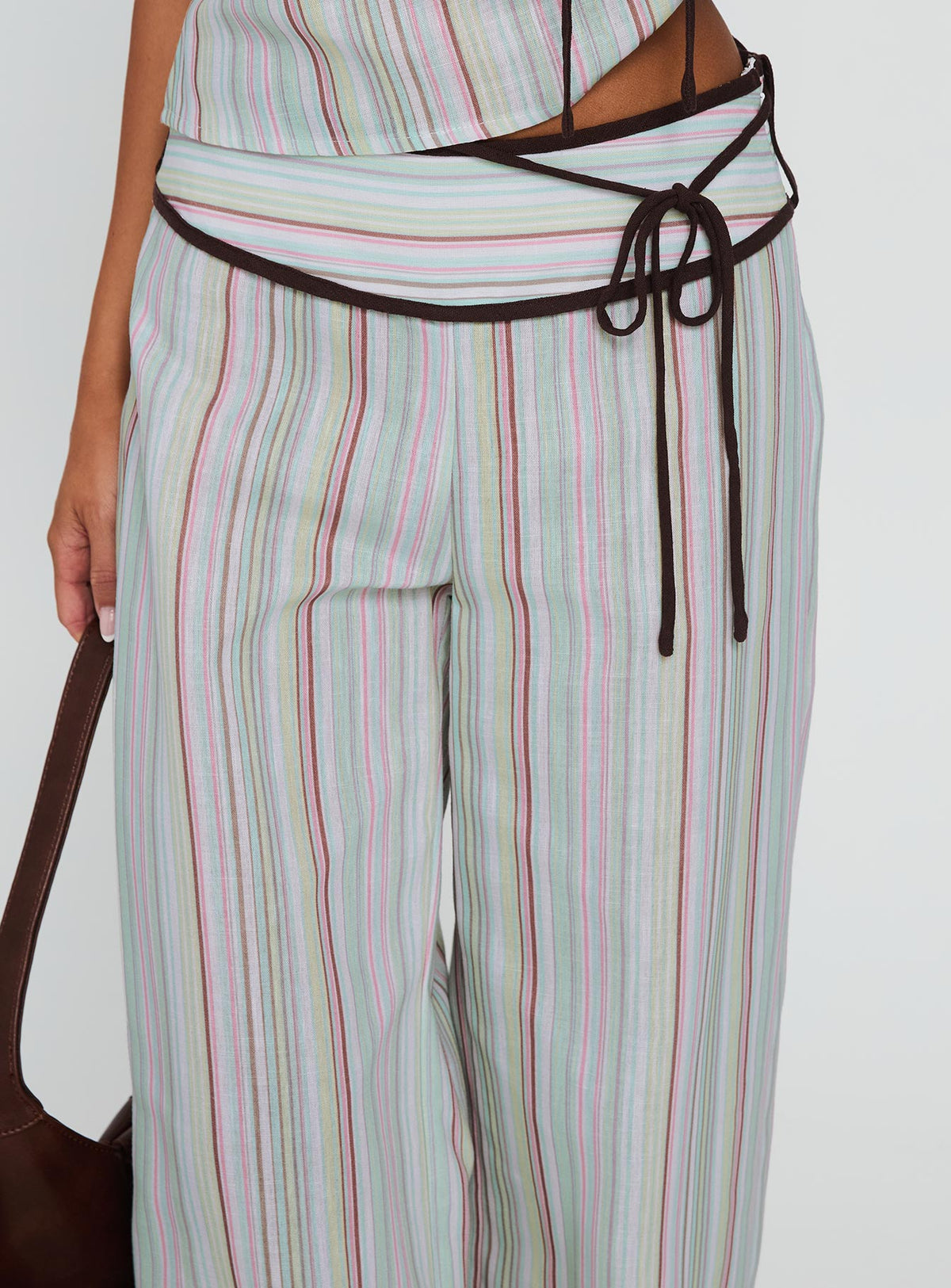 back view of model wearing Princess Polly Taylar Thick Waistband Tie Pants Green Stripe High Waisted Pants 
