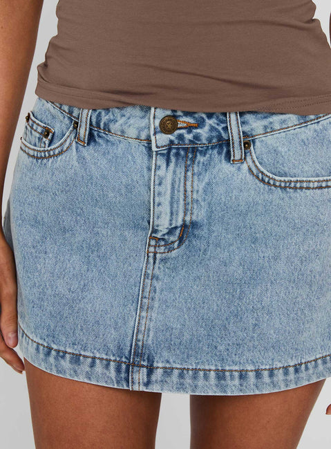 back view of model wearing Princess Polly Nicolina Low Rise Denim Mini Skirt Ice Blue Wash Mini Skirts 