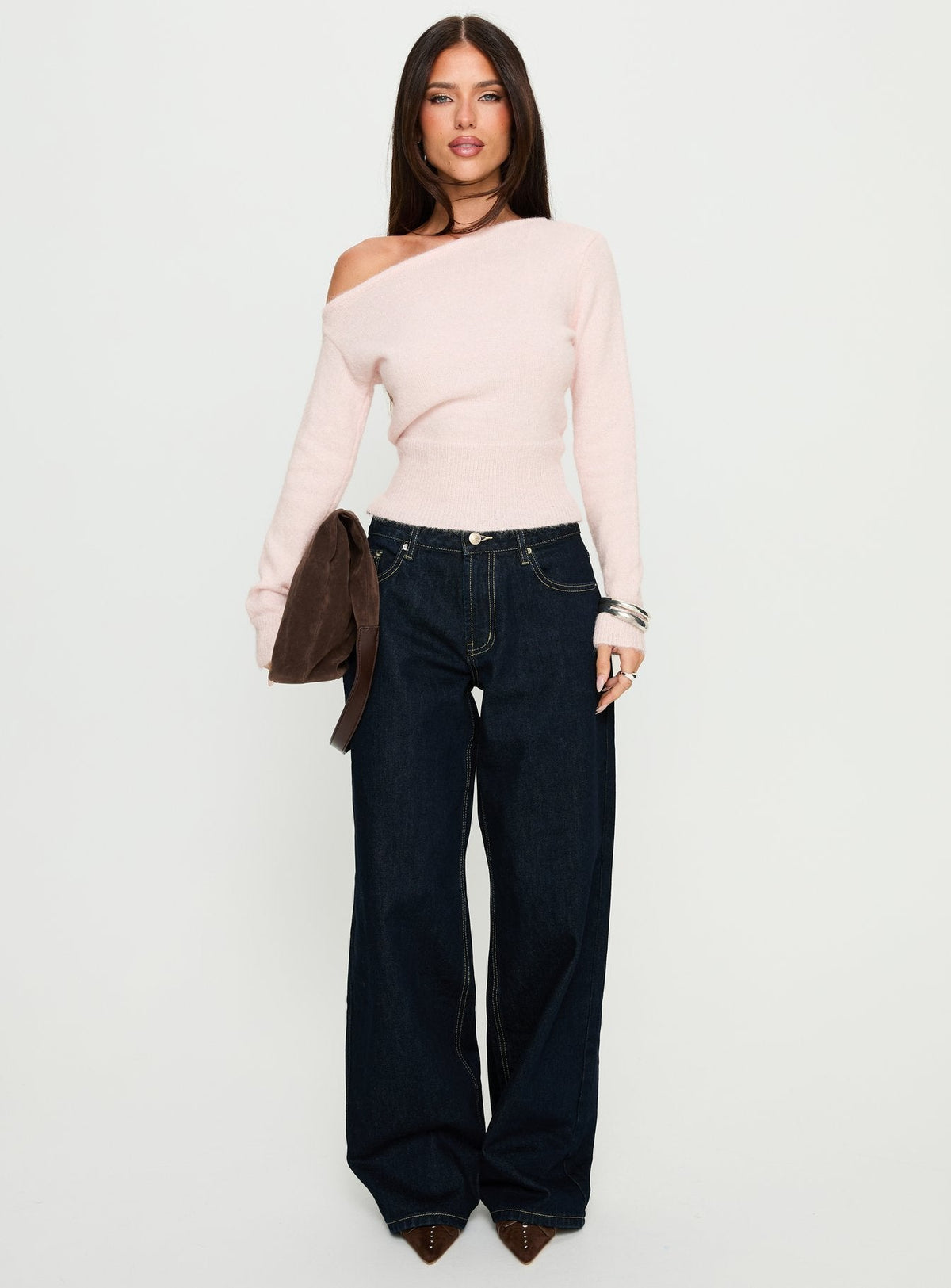 side view of model wearing Princess Polly Serenitia Mid Rise Relaxed Jeans Dark Raw Wash Mid Rise Jeans 