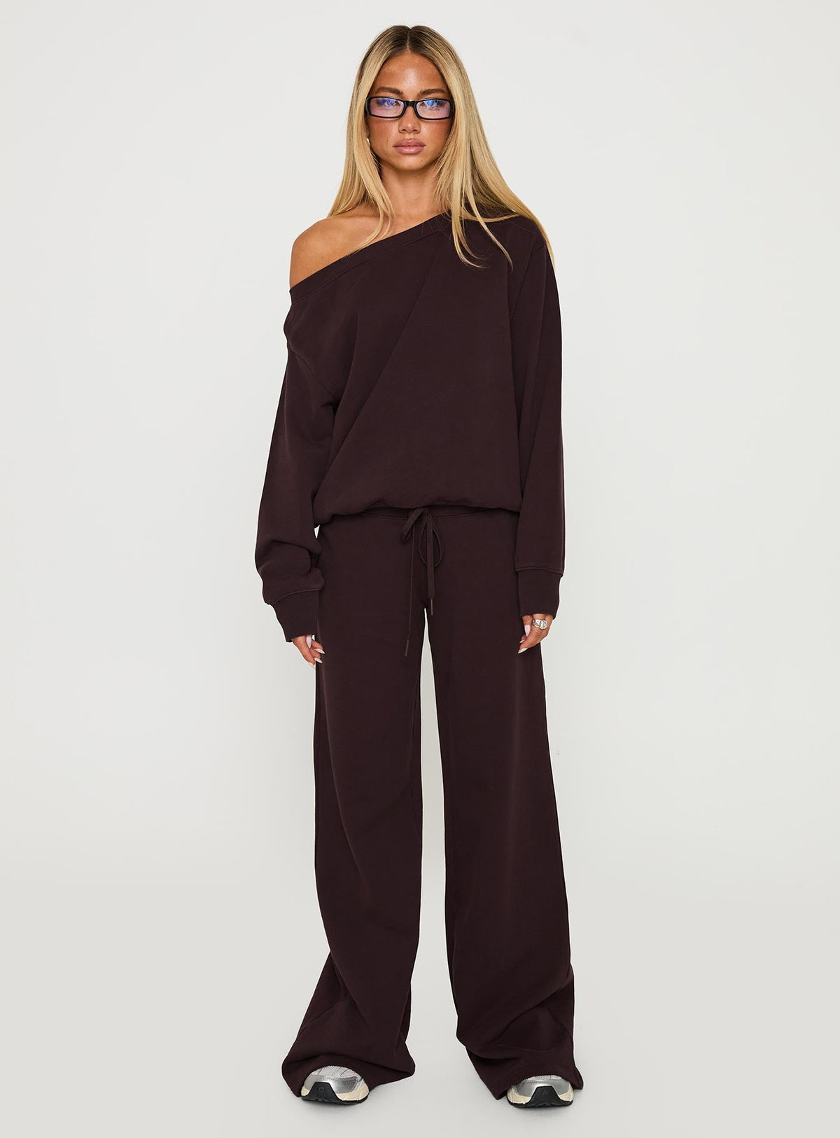 Showcasing the Wellness Off The Shoulder Jumper Brown in women's jumpers with long length and oversized fit front view of model wearing Princess Polly