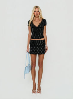 Featuring the Amia Lace Mini Skirt Black Polka Dot womens-skirts mini length front view of model wearing Princess Polly
