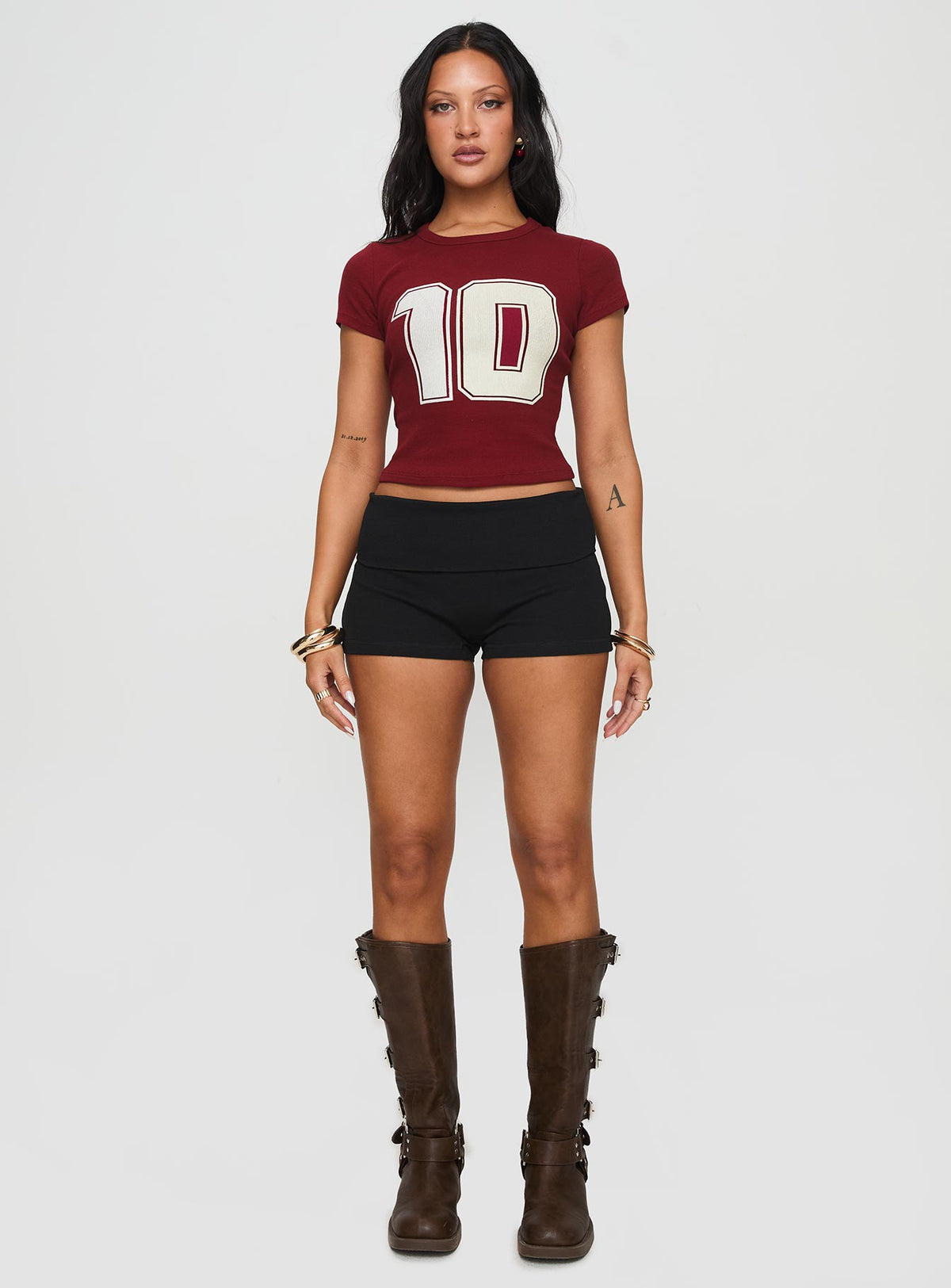side view of model wearing Princess Polly Baseline Low Rise Rib Shorts Black High Waisted Shorts 
