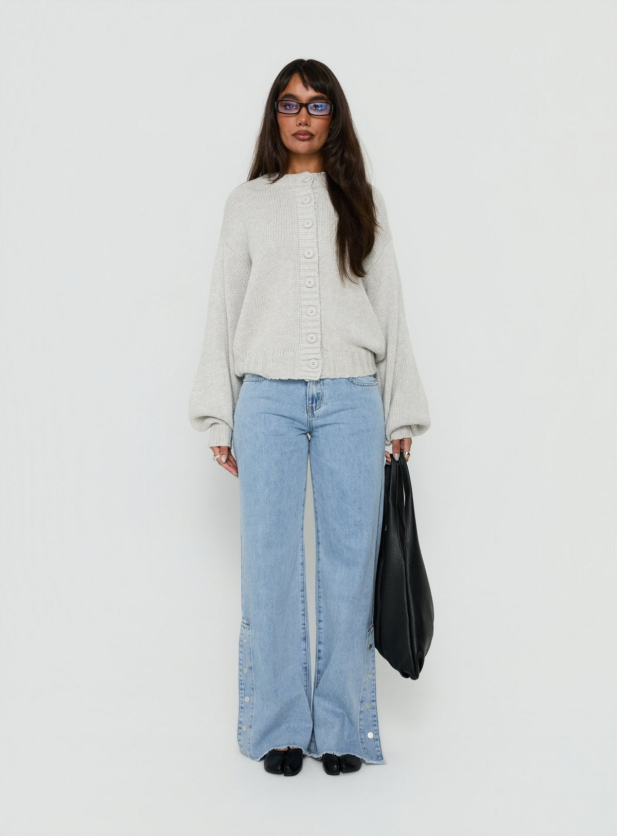 Showcasing the Edern Cardigan Light Grey Marle womens-jumpers in short oversized front view of model wearing