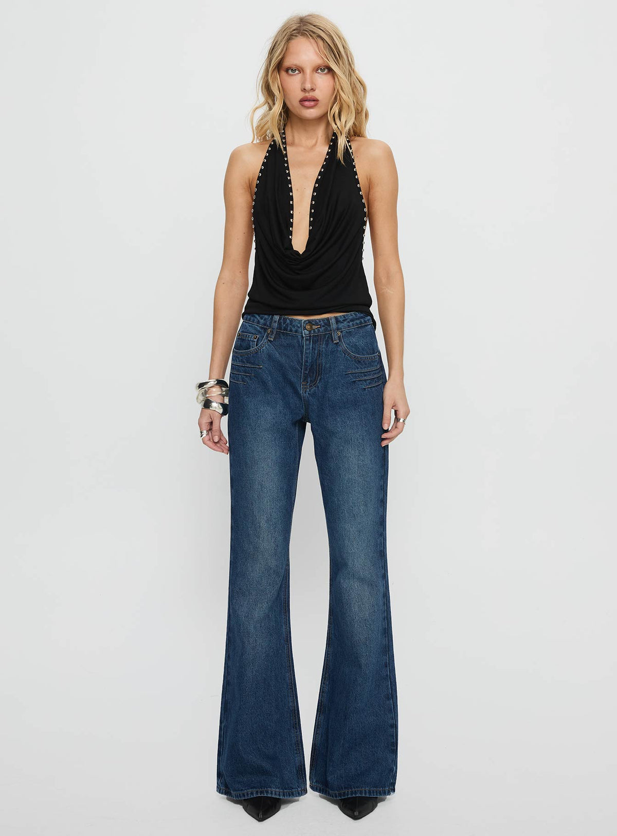 front view of model wearing Princess Polly Wide World Mid Rise Bootleg Jeans Mid Blue Mid Rise Jeans 