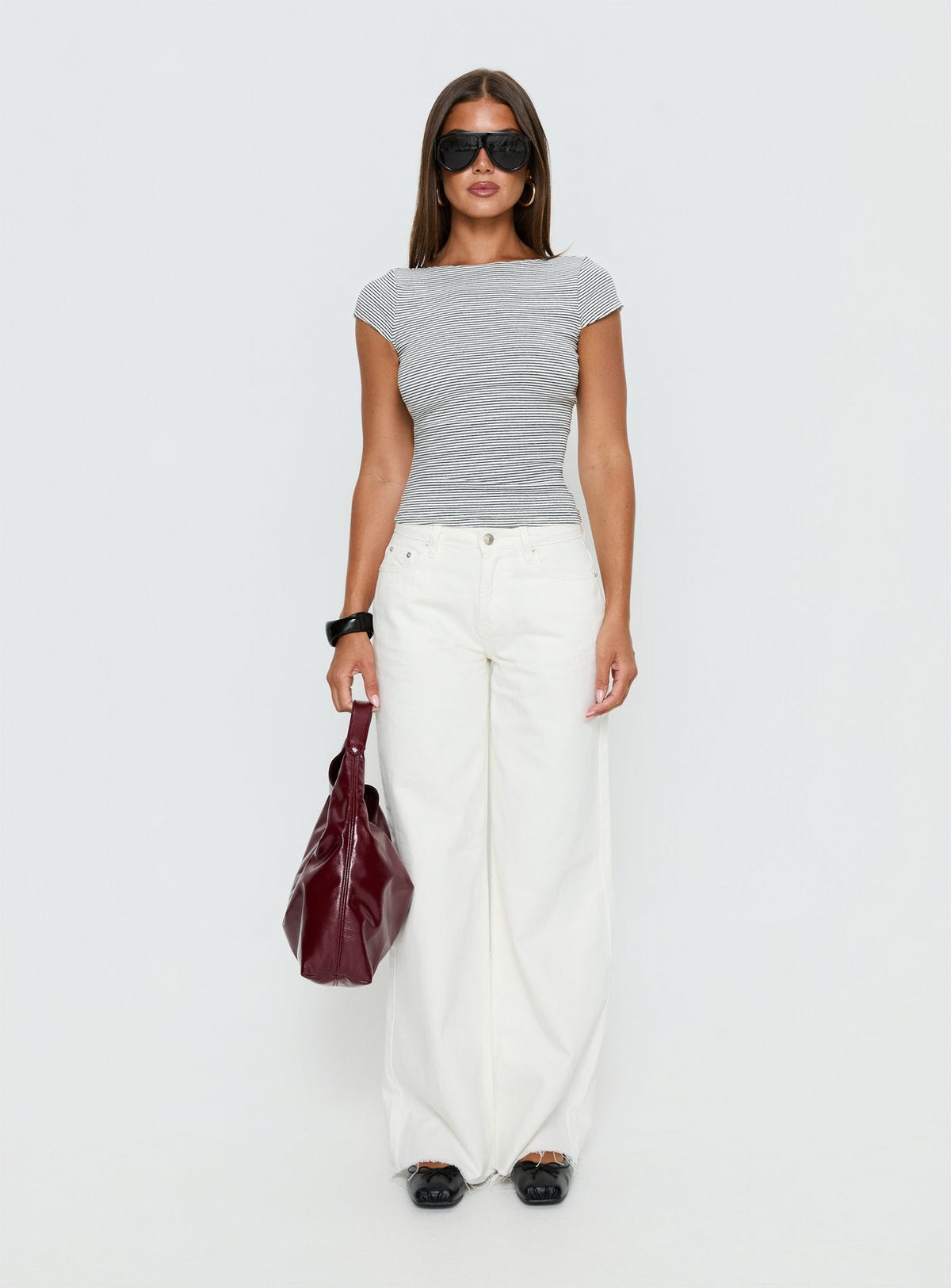 side view of model wearing Princess Polly Darla Low Rise Straight Leg Jean White Low Rise Jeans 
