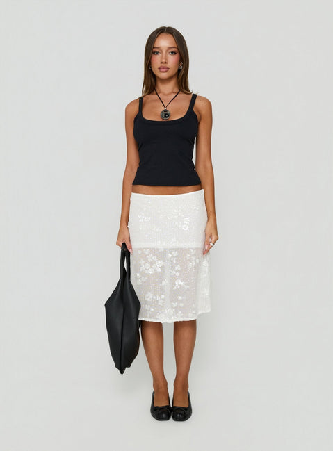 Showcasing the Heart Stealer Sheer Sequin Midi Skirt in White with fitted a-line shape and frayed hem front view of model wearing Princess Polly
