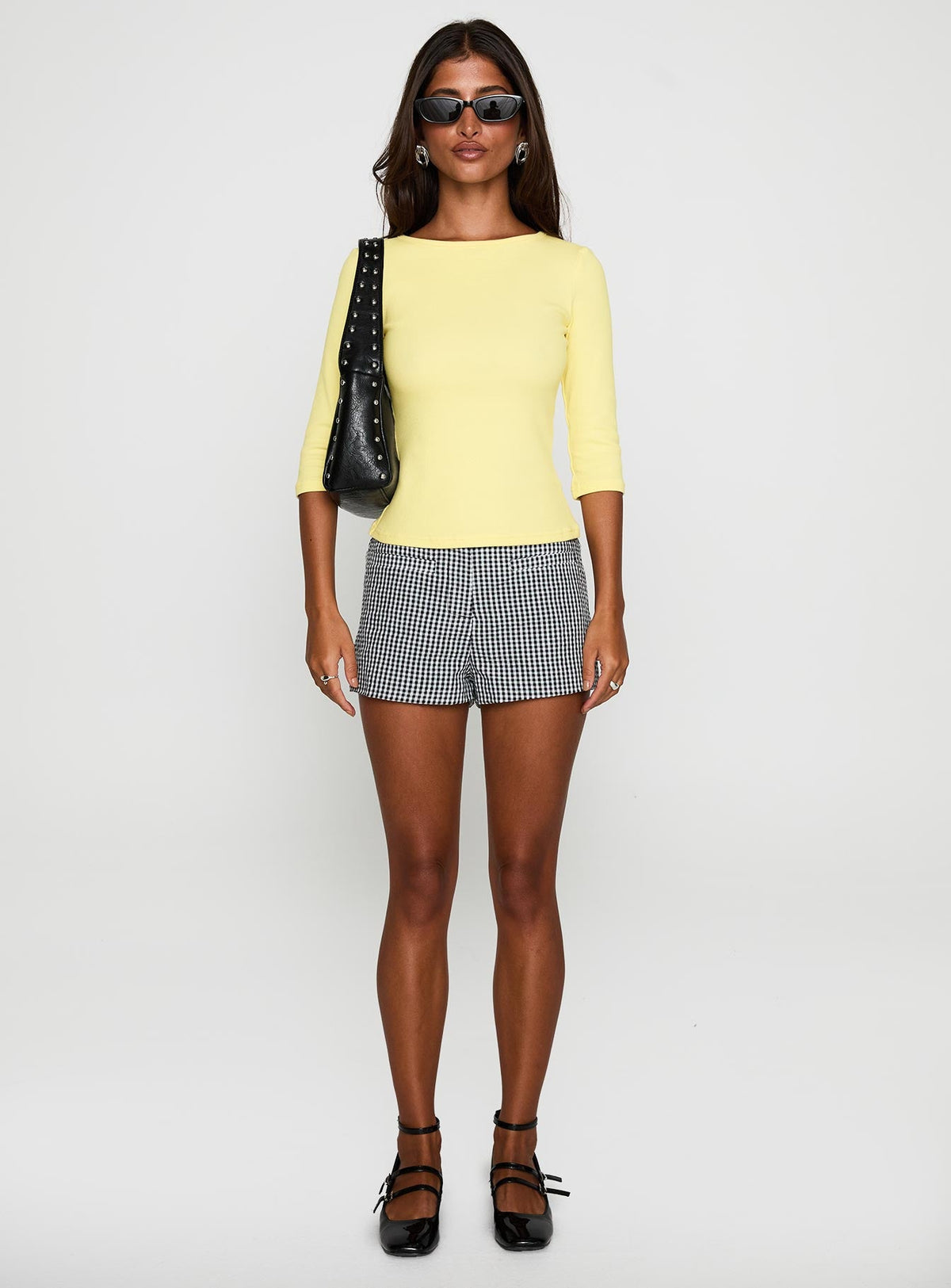 front view of model wearing Princess Polly Hot Commodity Micro Shorts Black Gingham Low Rise Shorts 