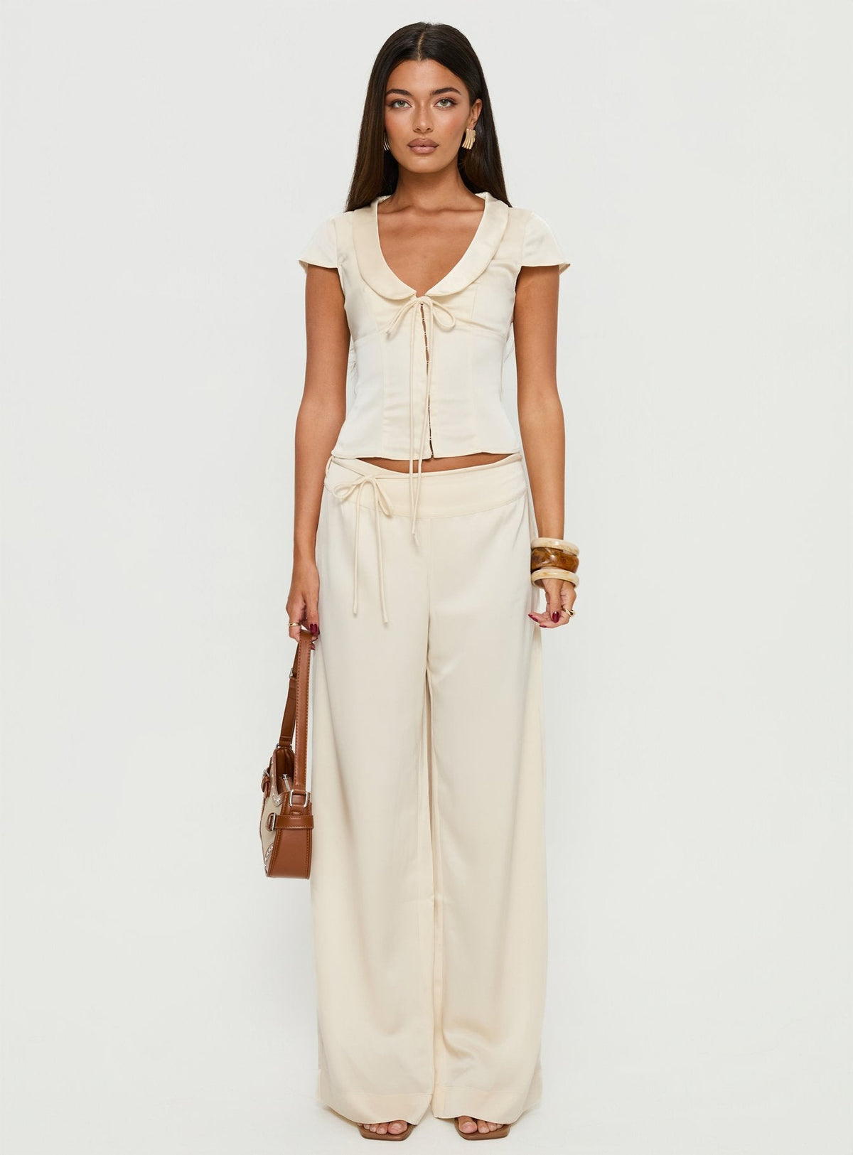 side view of model wearing Princess Polly Aubrette Satin Tie Pants Cream High Rise Pants 