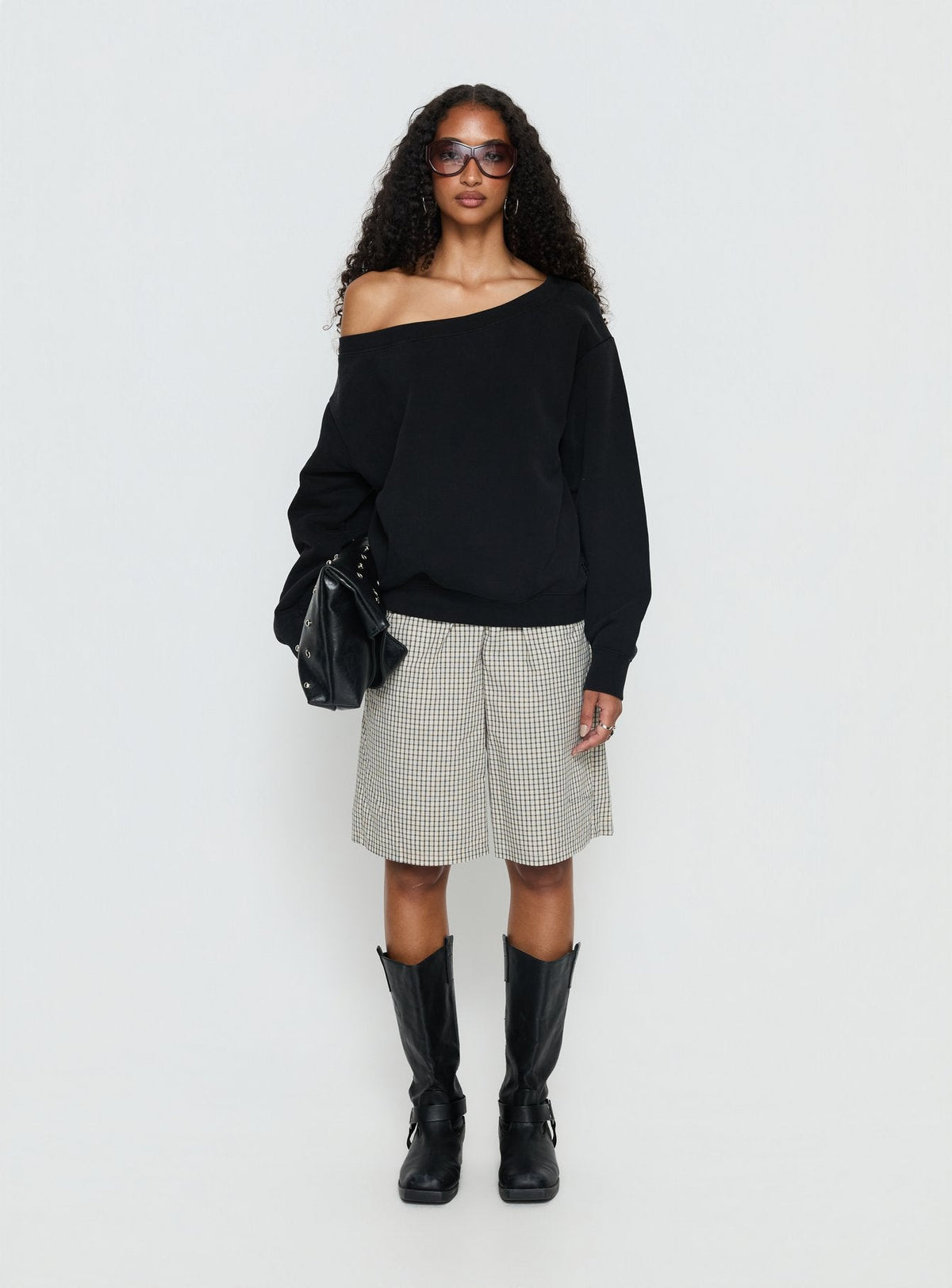side view of model wearing Princess Polly Wellness Off the Shoulder Jumper Washed Black Longline Jumpers Jumpers 