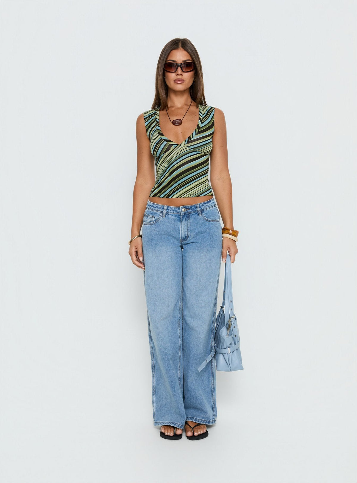 front view of model wearing Princess Polly Ramos Low Rise Wide Leg Denim Jeans Bright Blue Wash Mid Rise Jeans Jeans 