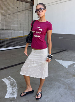 Showcasing the Heart Stealer Sheer Sequin Midi Skirt in White with fitted a-line shape and frayed hem front view of model wearing Princess Polly